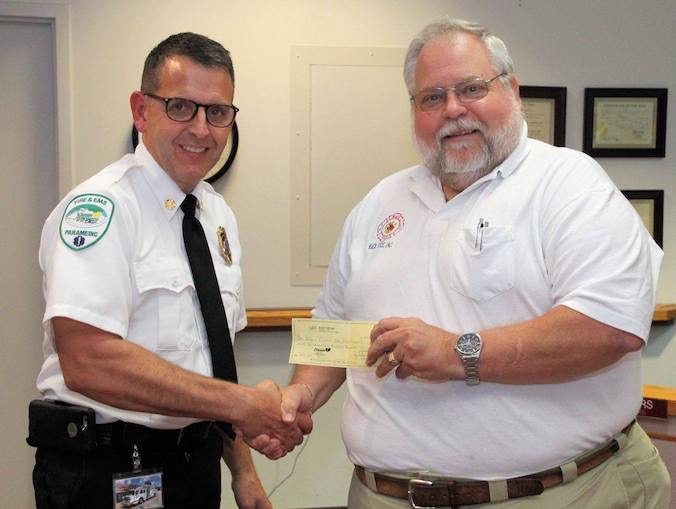 ed presents check to chief.jpg